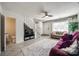 Open-concept living room with tile floors and a view of the stairs at 6374 Windsor Gate Ln, Charlotte, NC 28215