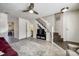 Spacious living room with tile floors, a staircase, and a glimpse of the upstairs bathroom at 6374 Windsor Gate Ln, Charlotte, NC 28215