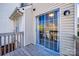 View of a patio with siding, a sliding glass door, and a small window at 6374 Windsor Gate Ln, Charlotte, NC 28215