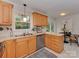 Traditional kitchen with stainless steel appliances, bright countertops, and a view to the backyard at 6523 Tall Oaks Trl, Charlotte, NC 28210