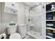 Bathroom featuring a glass-enclosed shower with sleek gray tile and a built-in shelving unit at 667 Portside Dr, Davidson, NC 28036