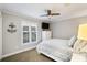 Cozy bedroom featuring a ceiling fan, shuttered windows, and classic anchor wall decor at 667 Portside Dr, Davidson, NC 28036