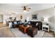 Spacious living room with hardwood floors, comfortable seating, and an open floor plan into the kitchen at 667 Portside Dr, Davidson, NC 28036