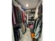 Organized walk-in closet with ample storage, shelving, and hanging space for clothes and accessories at 667 Portside Dr, Davidson, NC 28036