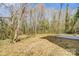 View of the empty lot next to the house with a concrete pad for a future addition at 709 Catawba St, Lincolnton, NC 28092