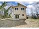 Exterior back view of the house featuring a sliding glass door and a small concrete patio at 709 Catawba St, Lincolnton, NC 28092