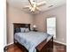 Cozy bedroom featuring a full bed, hardwood floors, and natural light from the window at 7507 Reedy Creek Rd, Charlotte, NC 28215