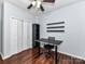 Comfortable bedroom with a ceiling fan, closet, and hardwood flooring offering a practical layout at 7507 Reedy Creek Rd, Charlotte, NC 28215