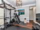 Home gym offering various fitness equipment and an inviting atmosphere perfect for workouts at 7507 Reedy Creek Rd, Charlotte, NC 28215