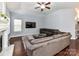 Comfortable living area with a ceiling fan, mounted TV, and a vaulted ceiling at 7507 Reedy Creek Rd, Charlotte, NC 28215