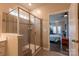 Bathroom with glass enclosed shower and view into bedroom at 8828 Powder Works Dr, Huntersville, NC 28078