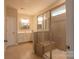 Bathroom featuring a walk-in shower with tile surround and vanity at 8828 Powder Works Dr, Huntersville, NC 28078