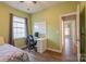 Bedroom with wood-look floors, natural light, and desk at 8828 Powder Works Dr, Huntersville, NC 28078
