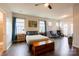 Spacious bedroom with sitting area, access to deck, and hardwood floors at 8828 Powder Works Dr, Huntersville, NC 28078