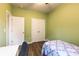 Bedroom with wood-look floors and natural light at 8828 Powder Works Dr, Huntersville, NC 28078