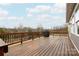 Spacious wooden deck with black metal railings, perfect for outdoor enjoyment and relaxation at 8828 Powder Works Dr, Huntersville, NC 28078