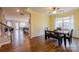 Bright dining room leads to staircase and has an open concept kitchen and living room at 8828 Powder Works Dr, Huntersville, NC 28078