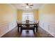 Bright dining room features wood floors, a large window, and modern lighting at 8828 Powder Works Dr, Huntersville, NC 28078