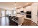Modern kitchen with stainless appliances, white cabinets, and a large center island at 8828 Powder Works Dr, Huntersville, NC 28078