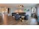 Inviting living room featuring a large sectional sofa and hardwood floors at 8828 Powder Works Dr, Huntersville, NC 28078