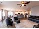 Open-concept living area with a modern kitchen, stainless appliances, and breakfast bar at 8828 Powder Works Dr, Huntersville, NC 28078