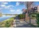 Picturesque lakeside path beside well-manicured lawns, offering residents a serene retreat by the water's edge at 9035 J M Keynes Dr # 33, Charlotte, NC 28262