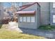 Mailbox station with covered awning and lighting in a well-maintained community at 9035 J M Keynes Dr # 33, Charlotte, NC 28262