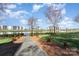Scenic walking path showcasing meticulously maintained landscaping and tranquil lake views that are perfect for relaxation at 9035 J M Keynes Dr # 33, Charlotte, NC 28262