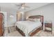 Serene bedroom featuring a comfortable king-size bed, a ceiling fan, and soft, neutral decor at 9035 J M Keynes Dr # 33, Charlotte, NC 28262