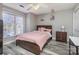 Cozy bedroom featuring a ceiling fan and a window with a view at 9035 J M Keynes Dr # 33, Charlotte, NC 28262