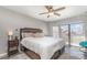 Bright bedroom with a king bed, soft bedding, and a view of the outdoors through a large window at 9035 J M Keynes Dr # 33, Charlotte, NC 28262