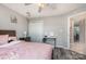 Bedroom showcasing a full bed and a ceiling fan at 9035 J M Keynes Dr # 33, Charlotte, NC 28262