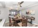 Inviting dining area with a round wooden table, seating for four, and a view into the kitchen at 9035 J M Keynes Dr # 33, Charlotte, NC 28262