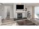 Comfortable living room with a fireplace, television, and a gray accent wall, perfect for relaxing at 9035 J M Keynes Dr # 33, Charlotte, NC 28262