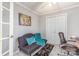 A versatile room featuring a futon, workspace, and calming decor at 9035 J M Keynes Dr # 33, Charlotte, NC 28262