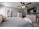 Bedroom with gray walls, white furniture, ceiling fan, and en-suite bathroom at 944 Clear Creek Cir, Lincolnton, NC 28092