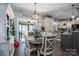 Dining area adjacent to kitchen with round table, seating for four, and wood floors at 944 Clear Creek Cir, Lincolnton, NC 28092