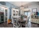 Dining area adjacent to the kitchen featuring wood floors and seating for four at 944 Clear Creek Cir, Lincolnton, NC 28092