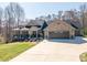 Stunning brick home with a welcoming front porch and spacious three-car garage on a sunny lot at 944 Clear Creek Cir, Lincolnton, NC 28092