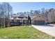 A charming single-Gathering home has a covered porch, manicured lawn, and a spacious two-car garage at 944 Clear Creek Cir, Lincolnton, NC 28092