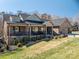 A charming single-Gathering home has a covered porch, manicured lawn, and a spacious two-car garage at 944 Clear Creek Cir, Lincolnton, NC 28092