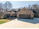 A charming single-Gathering home has a covered porch, manicured lawn, and a spacious two-car garage at 944 Clear Creek Cir, Lincolnton, NC 28092