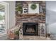 Charming stone fireplace featuring decorative accents and a rustic mantel display at 944 Clear Creek Cir, Lincolnton, NC 28092