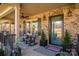 Charming front porch features brick accents, comfortable seating, and decorative elements at 944 Clear Creek Cir, Lincolnton, NC 28092