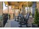 Cozy front porch with comfortable seating and decorative plants, perfect for relaxing outdoors at 944 Clear Creek Cir, Lincolnton, NC 28092