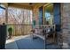 Welcoming porch featuring a comfortable bench with decorative pillows and a patterned rug at 944 Clear Creek Cir, Lincolnton, NC 28092