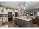 Kitchen featuring an island with granite countertop and stainless steel appliances at 944 Clear Creek Cir, Lincolnton, NC 28092