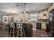 Stylish kitchen featuring a center island with seating, modern appliances, and custom cabinetry at 944 Clear Creek Cir, Lincolnton, NC 28092