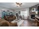Cozy living room with a stone fireplace, plush sofa, and inviting decor elements at 944 Clear Creek Cir, Lincolnton, NC 28092