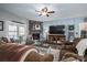 Spacious living room with a stone fireplace, large TV, and comfortable seating arrangement at 944 Clear Creek Cir, Lincolnton, NC 28092